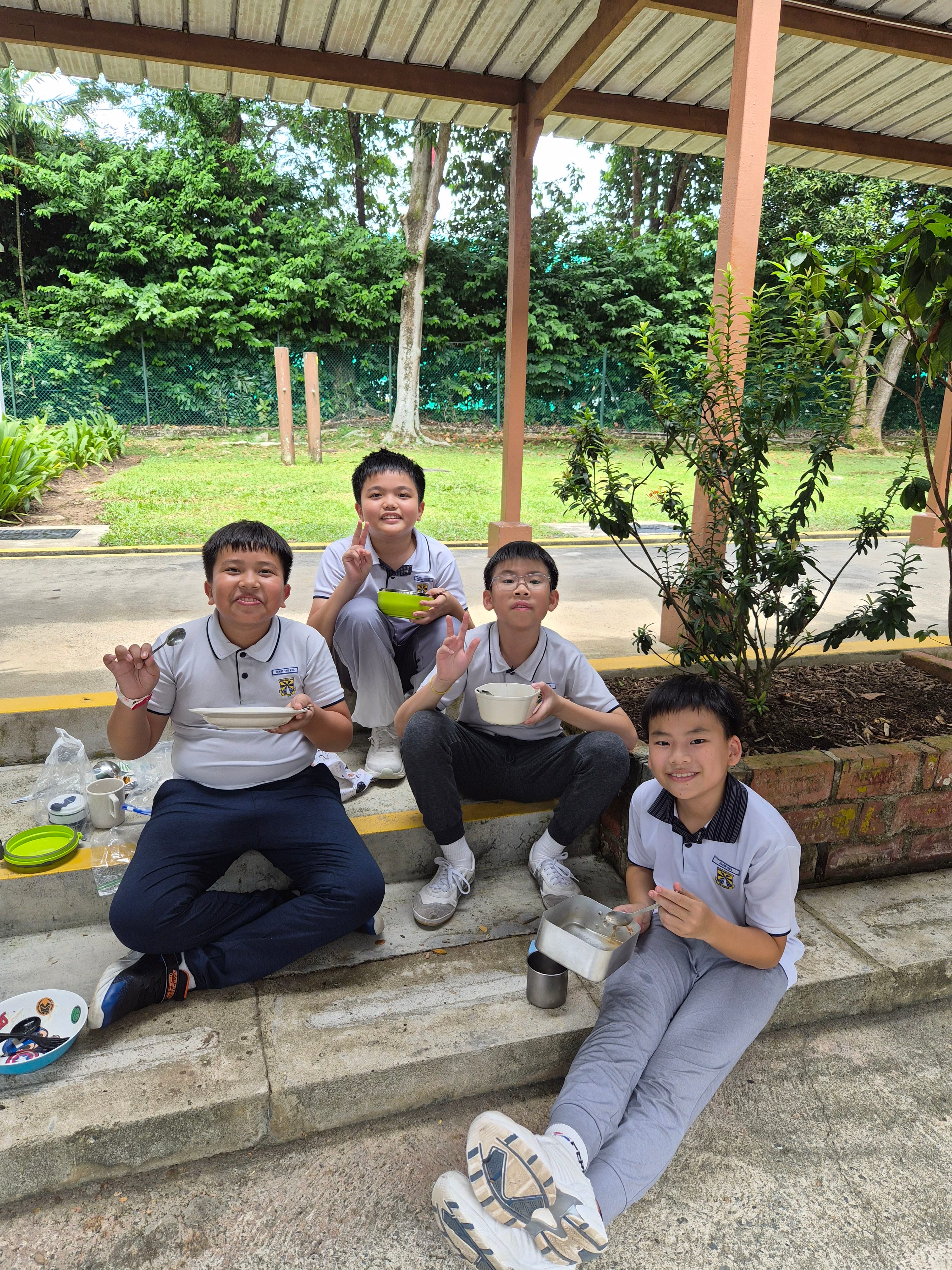 Mess tins, big appetites, and even bigger smiles after cooking outdoors.